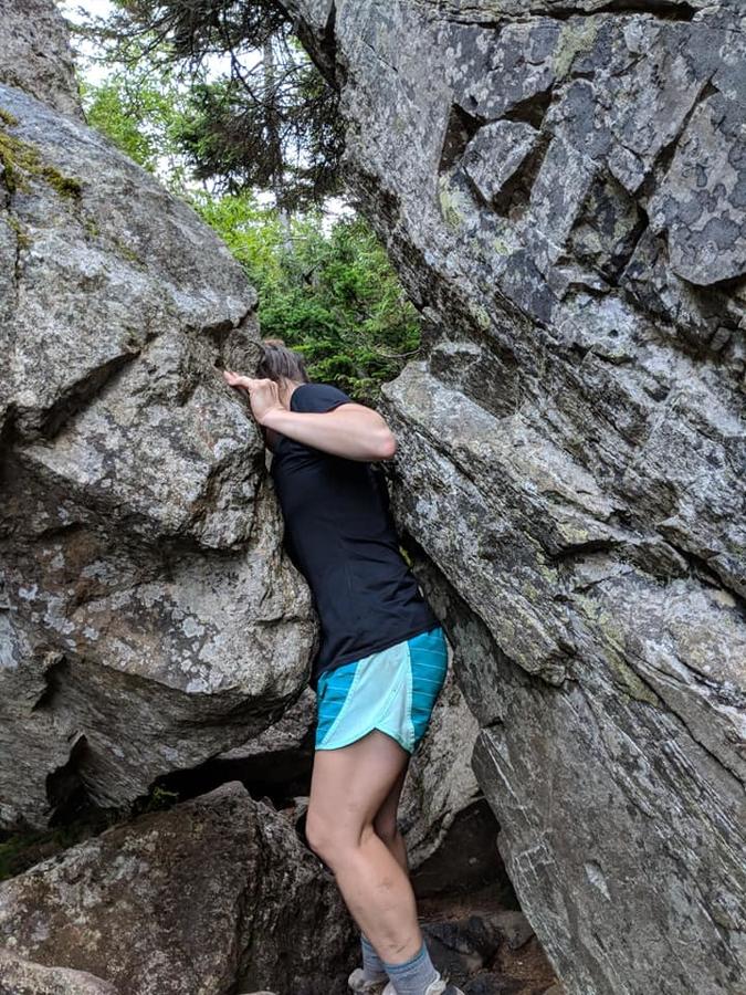 Traci between boulders.jpg