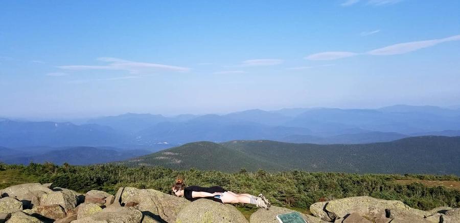 Traci laying top boulders.jpg